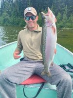 A person holding a fish AI-generated content may be incorrect. A person holding a fish AI-generated content may be incorrect.