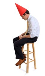 Sits with a dunce cap.jpg